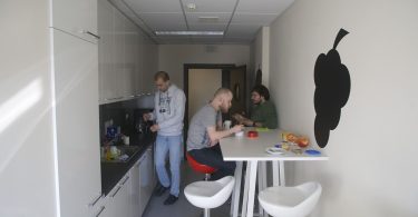 A worker relaxes during a short wellbeing break away from a desk in the office.